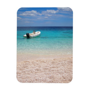 Íman Lancha no mar azul