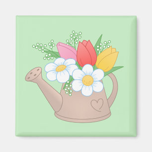 Íman Lata molhando do jardim com as flores no verde