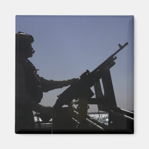 Íman Manning de um metralhador M240 no Iraque