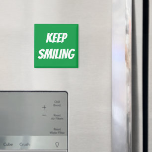 Íman Mantenha o ímã branco verde e sorridente