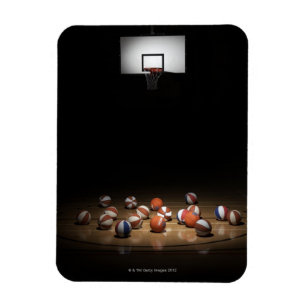 Íman Muitos basquetebol que descansam no assoalho