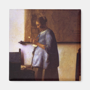 Íman Mulher no azul que lê uma letra