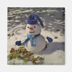 Íman Neve com chapéu azul, luvas e Scarf