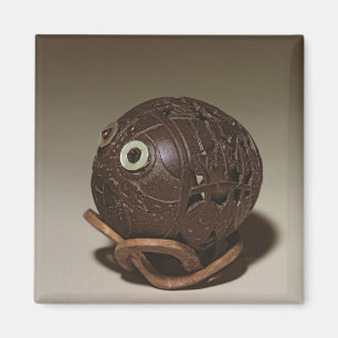 Íman O coco sculpted em uma cara, c.1895