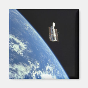 Íman O telescópio espacial de Hubble com uma terra azu