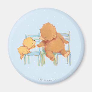 Íman O urso de Brown grande ajuda pouco urso amarelo