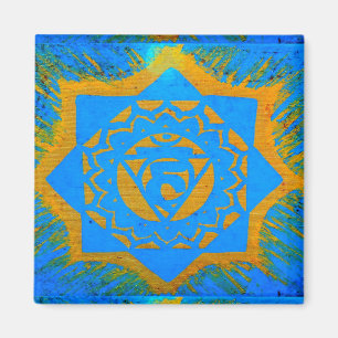 Íman ouro no símbolo tantric azul