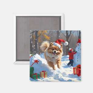 Íman Pomerânia Correndo na Neve com Chapéu de Natal