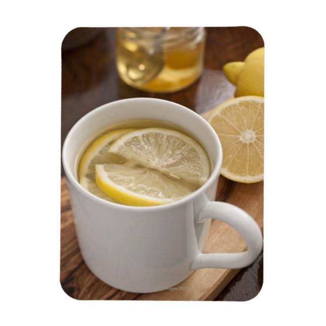 Íman remédio para gripe feito em casa; limões e mel (Vertical)