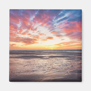 Íman Sunset sobre praia e mar
