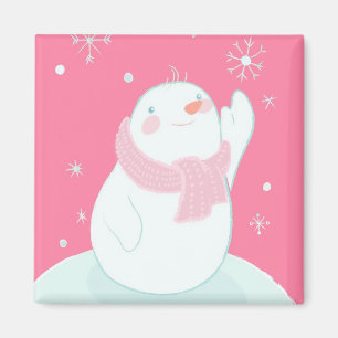 Íman Um boneco de neve que alcança para um floco de