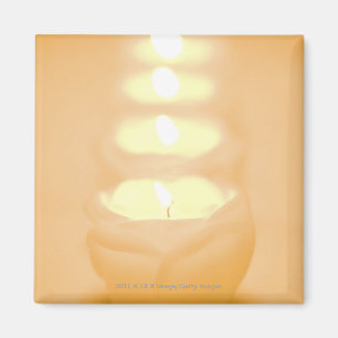 Íman Uma fileira de velas iluminadas