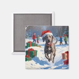 Íman Weimaraner Correndo na Neve com Chapéu de Natal