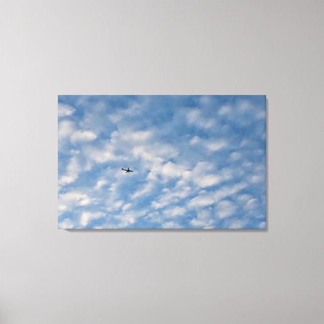 Impressão Em Tela Airplane Crossing a Cloud-Filled Blue Sky (Frente)