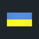 Impressão Em Tela Bandeira da Ucrânia, Ucraniano Слава Україні Slava<br><div class="desc">As cores da bandeira da Ucrânia, azul e amarelo, tremularam por séculos sobre uma terra rica em história e espírito. O azul representa o vasto céu ucraniano, enquanto o amarelo simboliza os campos de trigo dourado que se estendem pelas suas planícies férteis. Este símbolo simples, mas poderoso, tornou-se um farol...</div>