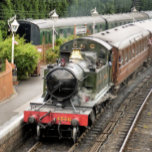 IMPRESSÃO EM TELA COMBOIOS DE VAPOR<br><div class="desc">Um trem a vapor bem restaurado e carruagems de uma era passada chegando à estação de trem. Inglaterra Reino Unido.</div>