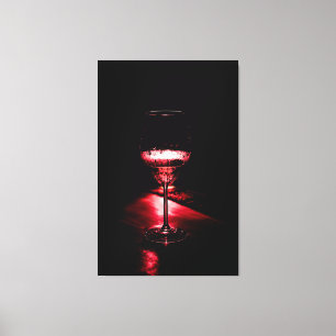 Impressão Em Tela Dramatic Red Backlit Wine Glass on Dark Wooden Sur
