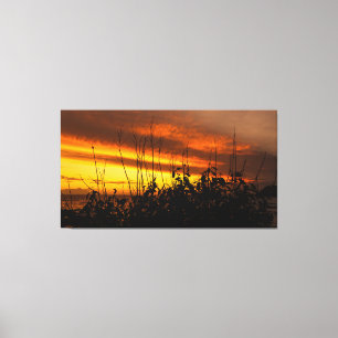 Impressão Em Tela Fiery Sunset Over Water with Silhouetted Vegetatio