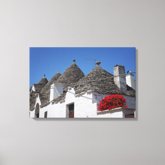 Impressão Em Tela Flores de gerânio e casas de trulli em Alberobello (Frente)