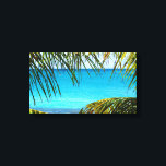 Impressão Em Tela Praia Tropical enquadrada com Palm Fronds<br><div class="desc">Uma bela fotografia de uma praia tropical. A água é cristalina e azul azul-azure. A imagem é emoldurada por algumas frentes de palma de abrigo. A praia tem areia branca e agradável. Uma imagem relaxante e calorosa.</div>