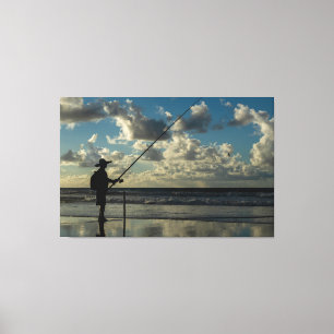 Impressão Em Tela Silhouette of a Lone Fisherman on the Beach at Sun