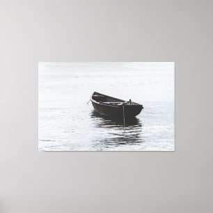 Impressão Em Tela Solitary Wooden Rowboat Moored on Calm Rippling Wa