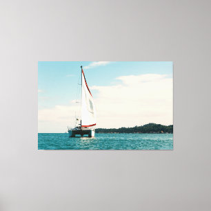 Impressão Em Tela White Catamaran Sailing on Turquoise Waters off th