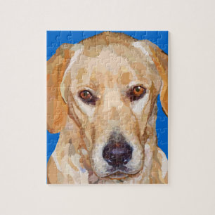 Labrador retriever que pinta o quebra-cabeça