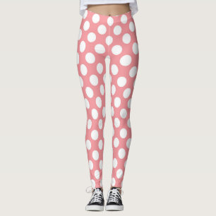 Legging bolinhas brancas sobre fundo rosa