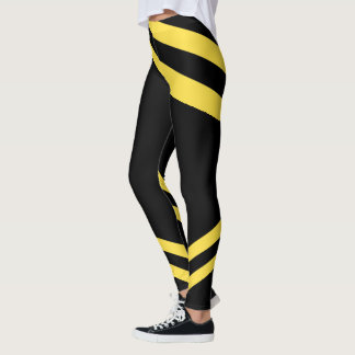 Legging Caneleiras pretas & amarelas do exercício do teste