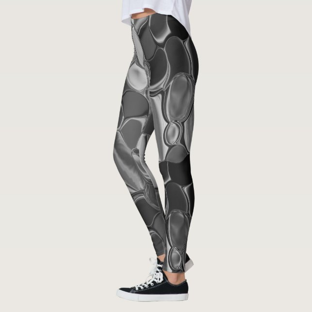 Legging Cinzas claras e formas arredondadas escuras. (Esquerda)