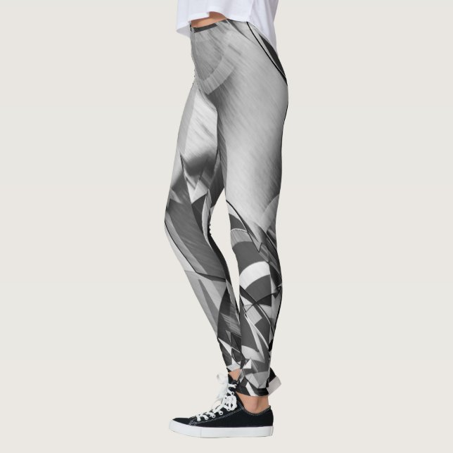 Legging Cinzas listram em alguma imagem preta e difusa (Esquerda)