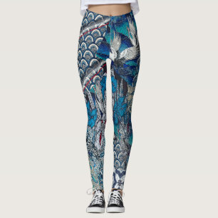 Legging Guindastes azuis que voam sobre flores