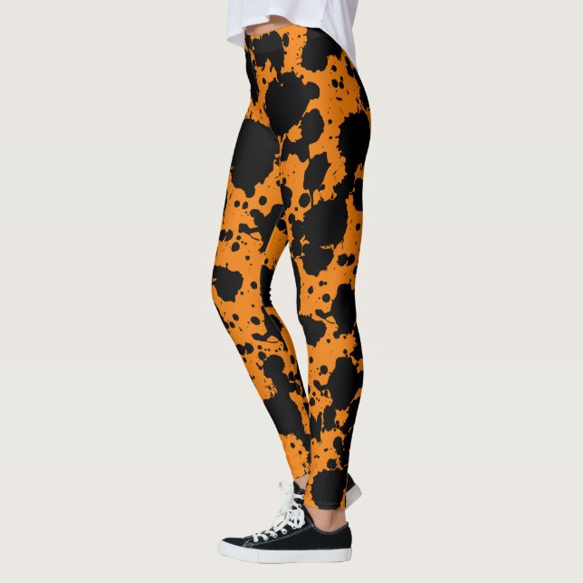 Legging Negra Moderna e Pintura Laranja Engraçada (Esquerda)