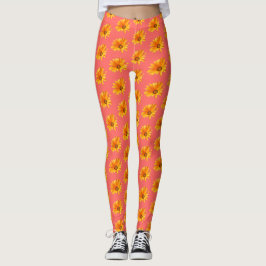 Legging Orange Cape Daisy contra fundo de coral vivo.