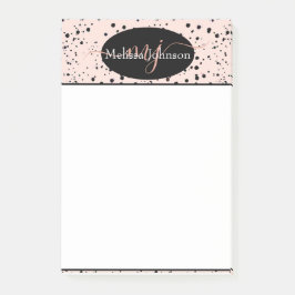 Letras elegantes em dourado rosa em bloco de notas