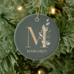 M Monograma Ornamento Cerâmico Personalizado Flora<br><div class="desc">Florial do monograma da letra M. A letra M,  de textura castanha ouro,  acentuada com folhas compostas de cor aquosa verde,  flores e pó de ouro. Persoalizado com o nome na fonte correspondente.</div>