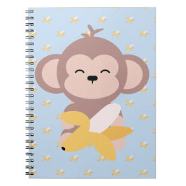 Macaco bonito de Kawaii com caderno da banana