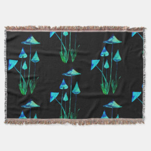 Manta Cogumelos que incandescem na cobertura escura de