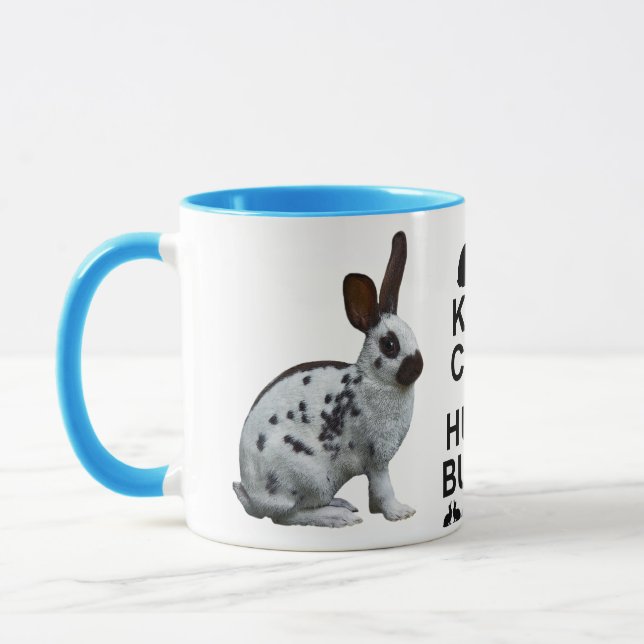 Mantenha a calma e abrace uma caneca do coelho (Esquerda)