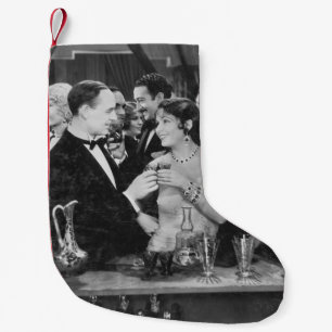 Meia De Natal Pequena Casal bebendo no bar lotado