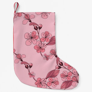 Meia De Natal Pequena Cereja floresce de cor rosa sobre fundo branco.