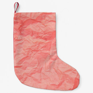 Meia De Natal Pequena Feche a ruga rosa amassada com papel p