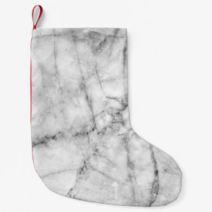 Meia De Natal Pequena Padrão na textura do chão de mármore branco e nas