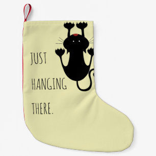 Meia De Natal Pequena Só pendurado ali um desenho de um gato preto, um 