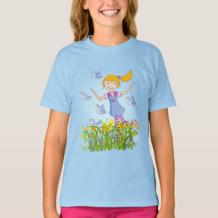 Menina nos daffodils que perseguem o t-shirt do