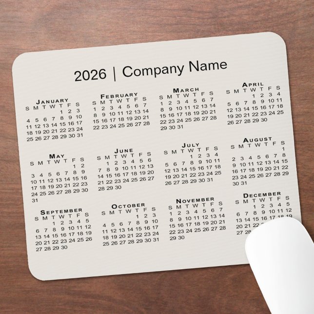 Mousepad Calendário Simples de 2026 com Nome da Empresa em  (Simple 2026 Calendar with Company Name on Beige Mouse Pad, in situ)
