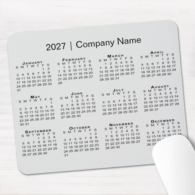 Mousepad Calendário Simples de 2027 com Nome da Empresa Cin (Simple 2027 Calendar with Company Name Grey Mouse Pad in situ)
