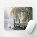 Mousepad Canada Geese on a Misty Lake<br><div class="desc">A tranquil lake features a rustic wooden dock beneath elegant willow branches in the mist,  while two Canada geese glide across the still water,  creating gentle ripples behind them</div>