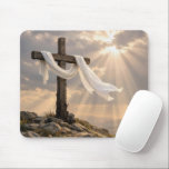Mousepad Easter Cross with Shroud at Sunrise<br><div class="desc">A wooden cross wrapped in white fabric stands on a rocky hill,  bathed in warm sunlight that pierces through the clouds</div>